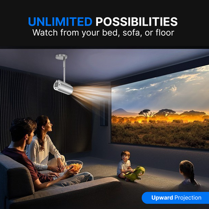 Product photography of a family of four watching an upward projection movie in a dark modern living room, featuring a sleek silver ceiling projector displaying a vibrant safari sunset with elephants and the text UNLIMITED POSSIBILITIES