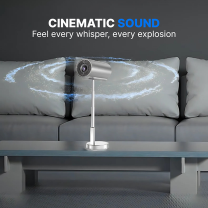 A modern silver cylindrical entertainment device on a stand in a minimalist living room, featuring blue swirling sound wave graphics around it and CINEMATIC SOUND text above, against a dark grey sofa and coffee table