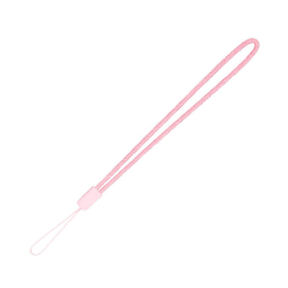 Product photograph of a light pink woven wrist strap featuring a small plastic clip and a delicate loop for attachment